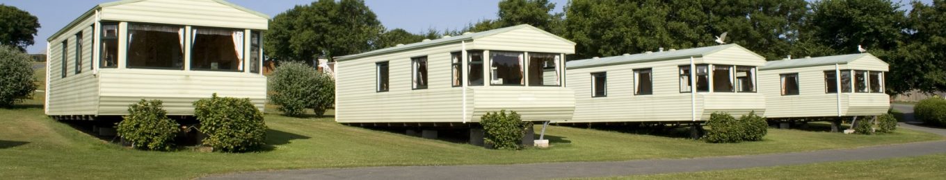 4 static caravans parked in a row
