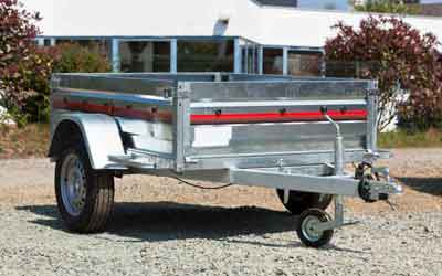 small trailer on gravel driveway