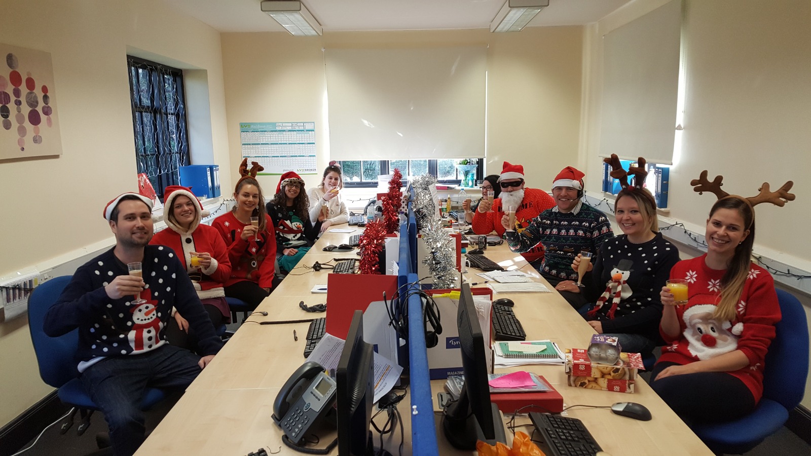 MyInsurance employees in their office at Christmas